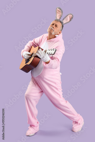 Senior man in Easter bunny ...