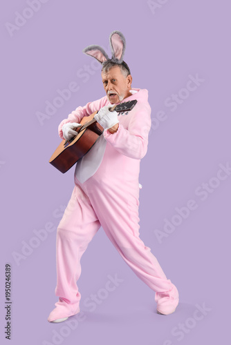 Senior man in Easter bunny ...