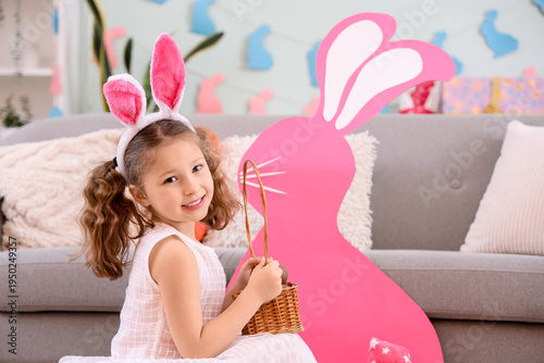 Cute little girl in bunny e...