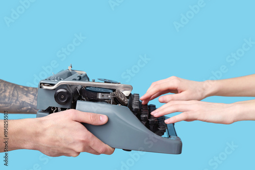 Hands holding vintage typew...