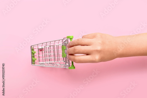 Female hand with green shop...