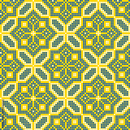 Seamless Ukrainian embroidery vector pattern inspired by traditional vyshyvanka ornament. Ethnic geometric folk design made in cross stitch style with yellow and blue stitches