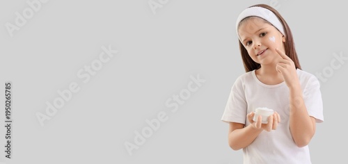 Cute little girl with jar o...