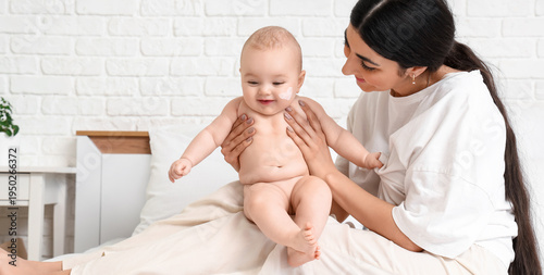 Happy mother and her cute l...
