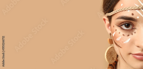 Canvas Print Beautiful young woman with Indian makeup on beige background, closeup