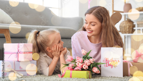 Cute little girl with her mom and gifts for Mother's Day on floor in living room