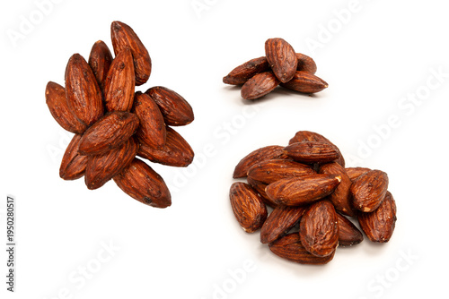 Tableau sur toile A group of caramelized almonds isolated on a white background.