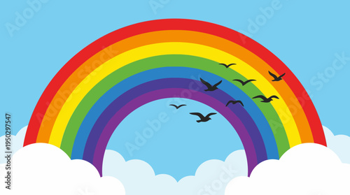 A vibrant rainbow with red, orange, yellow, green, blue, indigo, and violet colors arches across a bright blue sky with fluffy white clouds and flying bird silhouettes.