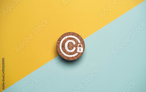 Copyright protection concept with copyright symbol and security lock on cork for creative thinking idea intellectual property rights protection, licensing law and digital patent ownership.