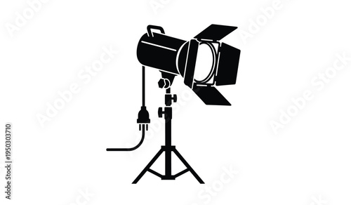 A professional studio spotlight mounted on a tripod stand used for film and photography lighting