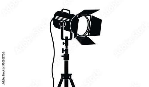 Professional studio spotlight with adjustable barn doors mounted on a sturdy telescopic tripod