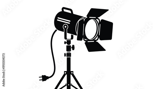 Professional studio light fixture with barn doors mounted on a sturdy adjustable tripod stand