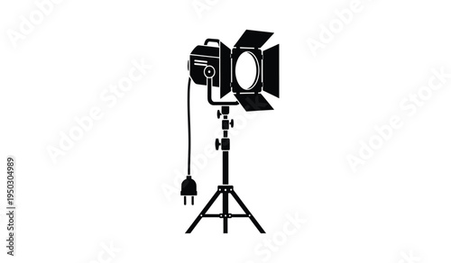 Professional studio spotlight equipment mounted on an adjustable tripod stand for film production