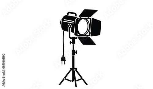 Professional studio lighting equipment featuring a powerful spotlight mounted on a tripod stand