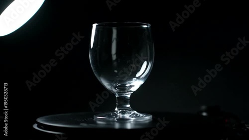 A wine glass on a table.