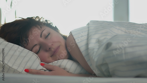Billede på lærred happy woman puts her head on a pillow, woman did all the work and go to bed, hav
