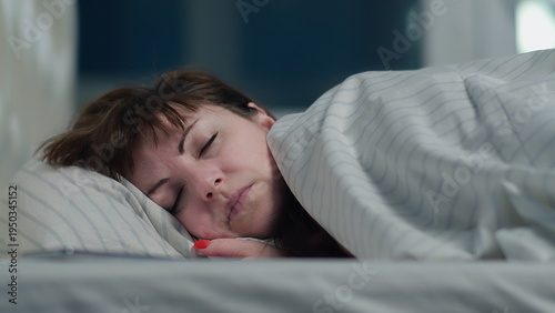 Obraz na plátně brunette woman puts her head on a pillow, woman did all the work and go to bed,
