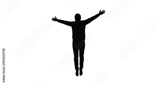 A solitary silhouette of a person stands with arms outstretched suggesting freedom celebration or spiritual connection high quality professional