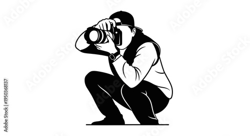 Photographer crouching low to take a picture with a professional camera.