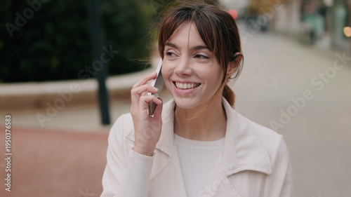 Smiling Woman Talking on the Phone Outdoors