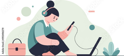 A person with headphones and a phone sits near a laptop and briefcase