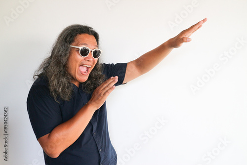 Photography Adult man showing happy expression and standing in front of white isolated wall