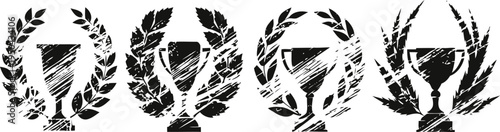 Four black trophies surrounded by laurel wreaths in various styles and silhouettes