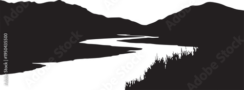 Silhouette of a winding river flowing through mountains