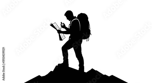 Silhouette of a male hiker standing on a mountain peak holding a map and compass