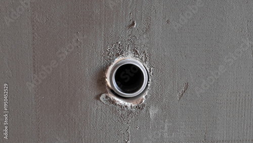 Round Conduit Hole In Wall, Inspector Documenting Penetration During House Construction Closeup Of Circular Opening With Mortar Edges And Raw Plaster Texture, Practical View For Site