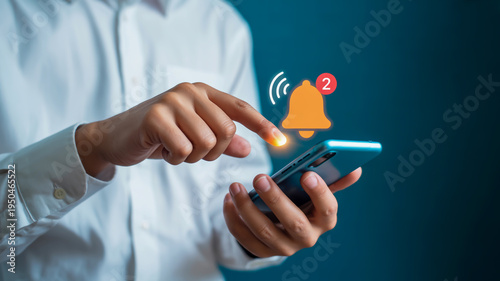 Man in white shirt holding phone with notification