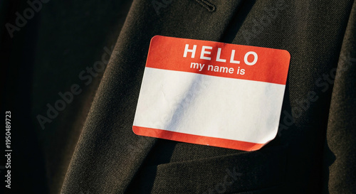 Fotografie Blank Hello My Name Is Sticker Badge on a Suit Jacket