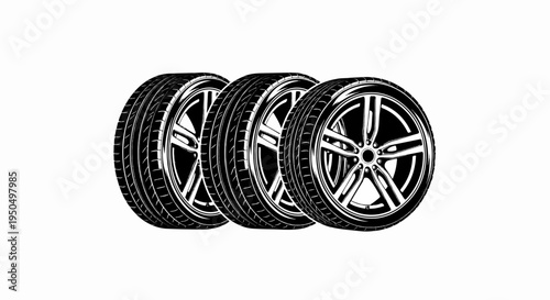 Three black and white car tires and rims are displayed in a row