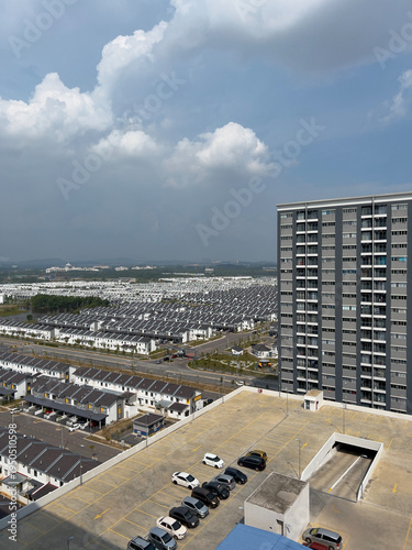 Cybersouth suburban housing sprawl next to apartment building. 