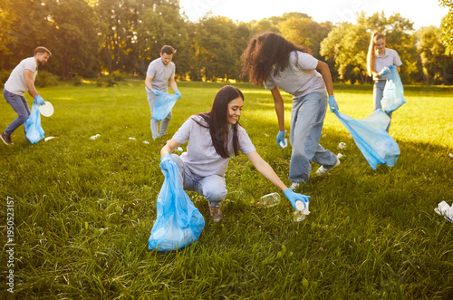 Obraz na plátně Group happy volunteers participating in environmental clean up day, working toge