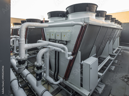 Industrial rooftop HVAC ventilation fans and air conditioning units system.