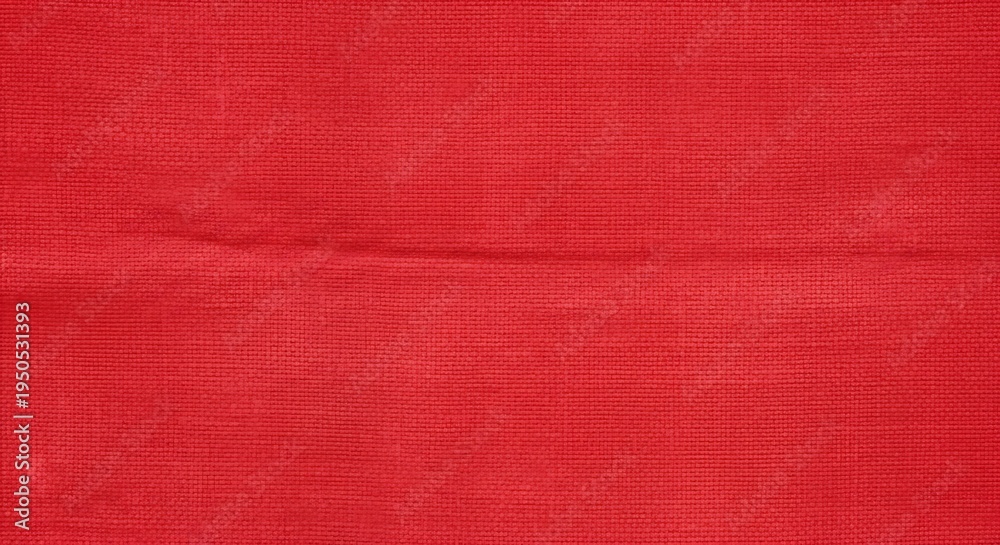 Fototapeta premium Vibrant Red Fabric Texture - A Close-Up of Rich Color and Subtle Details.