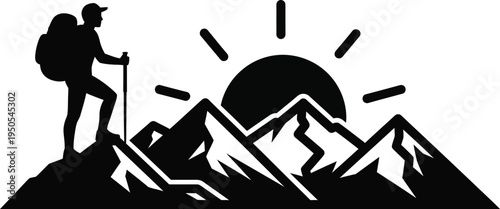 hiker on mountain peak at sunrise