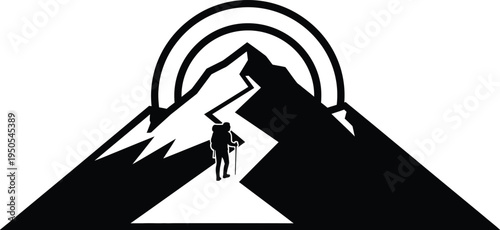 hiker standing on mountain peak at sunrise