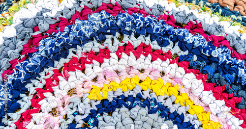 Tableau sur toile Vintage homespun doormat made from strips of cloth as background