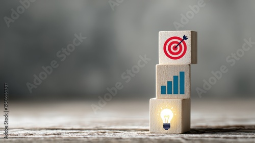 Business strategy concept with wooden blocks showing icons of target, growth, and creative idea