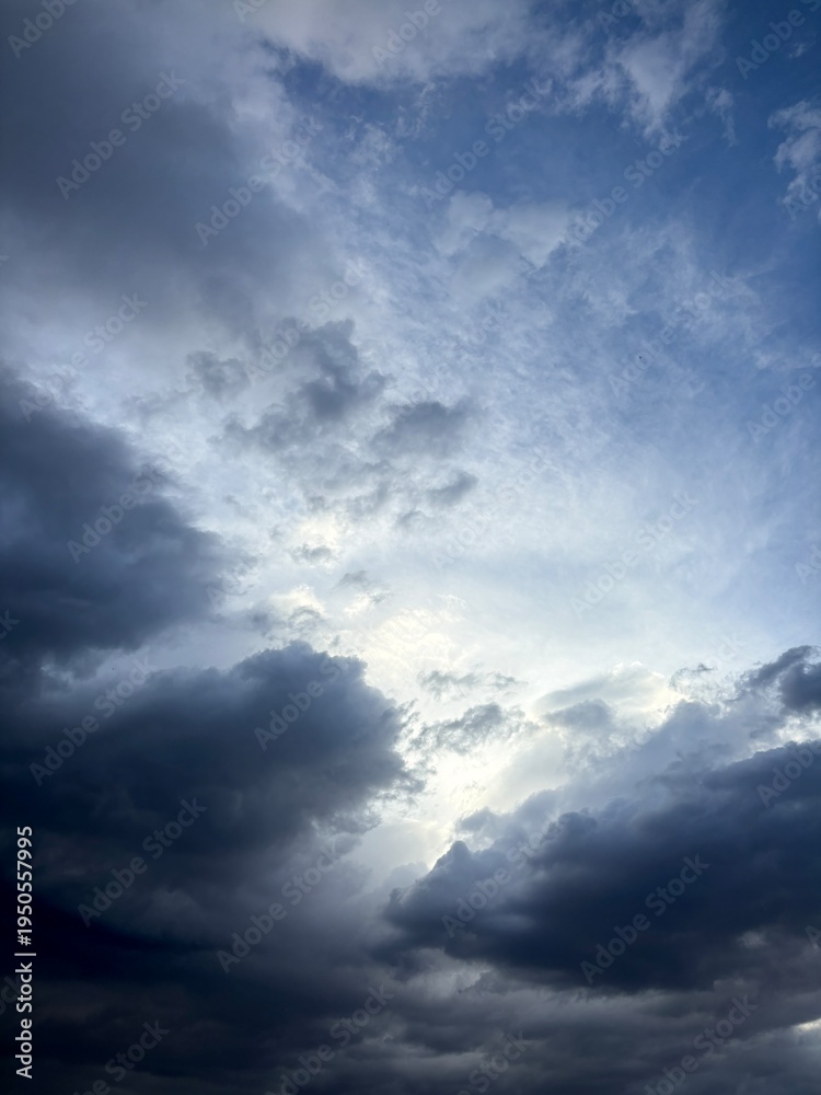 Fototapeta premium Dark Storm Clouds With Light Breaking Through Sky
