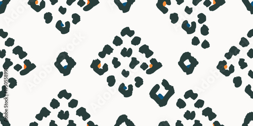 Stylized leopard print pattern with black orange and blue spots