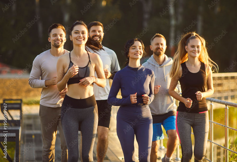 Naklejka premium Athlete runners team jogs together during outdoor training, enhancing group sport, building fitness through running, connecting members in synchronized group workout and jogging across a open terrain.