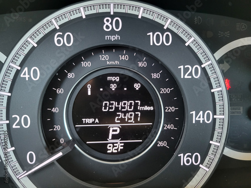Close-up of the instrument cluster with speedometer, odometer and various gauges and indicators 