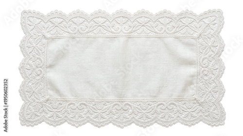 Fotografie Vintage rectangular white lace placemat with delicate floral embroidery on a tra