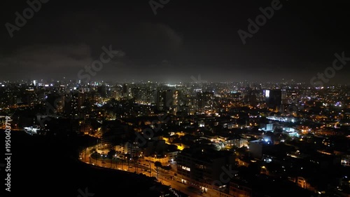 Wallpaper Mural 4K aerial view of Lima city at night with warm glowing lights during a calm night. Torontodigital.ca