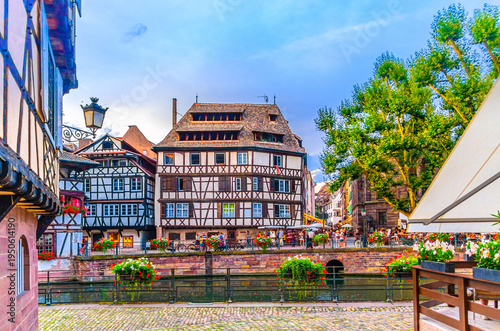 The Petite France Quarter Quartier des Tanneurs, quay embankment promenade of River Ill canal with medieval houses buildings in old town Strasbourg city historic Centre, Alsace region, France