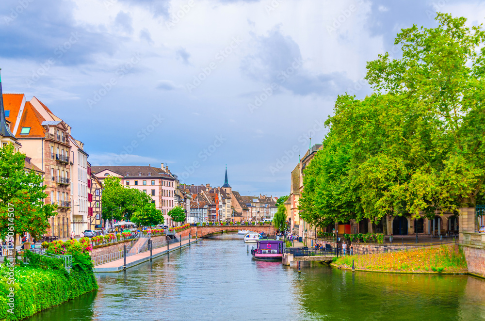Obraz premium River Ill canal water, Quai des Bateliers embankment with medieval buildings old houses in old town Strasbourg city historic Centre Ville Grande ile Grand Island, Alsace Grand Est region, France
