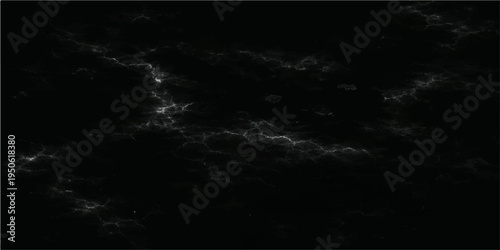 A striking, high-contrast, black and white abstract that reveals textured, luminous patterns reminiscent of clouds and galaxies. The intricate textures invite exploration.